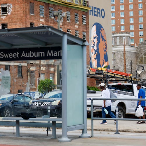 Pedestrians walk along Edgewood Avenue in Atlanta on July 30, 2025, just two days after one person was killed and 10 others were injured in a shooting in the area. A second suspect was recently arrested in the case. (Miguel Martinez/AJC)