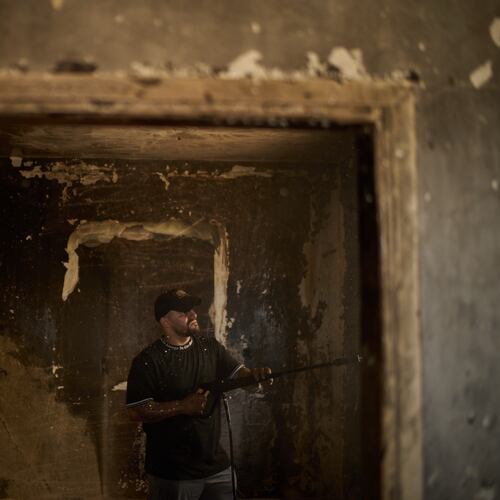 A Palestinian man cleans a room of a house damaged following an attack by Israeli settlers the previous day in the village of Sarra, near the West Bank city of Nablus, Saturday, July 25, 2026. (AP Photo/Leo Correa)