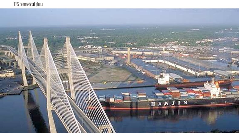 A cargo ship on the Savannah River passes under the Eugene Talmadge Memorial Bridge. AJC file