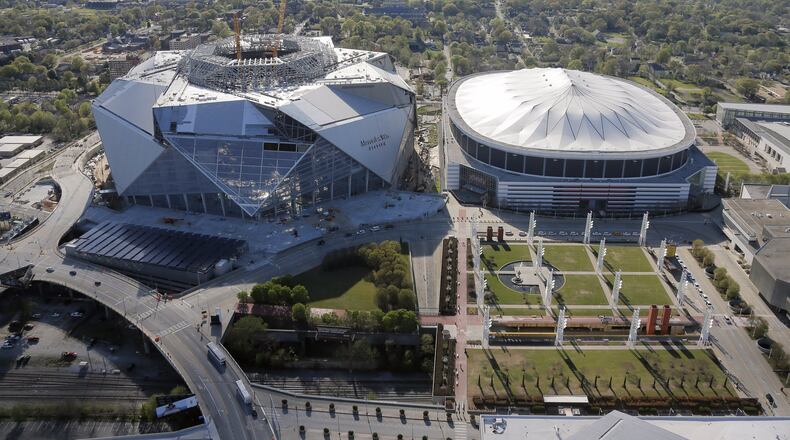 March 31, 2017 - Atlanta - Mercedes Benz Stadium, future home of the Atlanta Falcons, sits next to the Georgia Dome. Aerial photos shot March 31, 2017. BOB ANDRES /BANDRES@AJC.COM