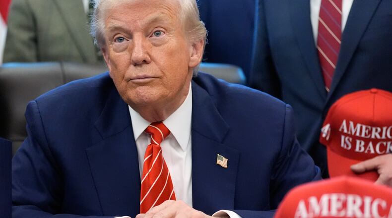 President Donald Trump speaks to reporters after signing a spending bill that ends a partial shutdown of the federal government in the Oval Office of the White House, Tuesday, Feb. 3, 2026, in Washington. (AP Photo/Alex Brandon)