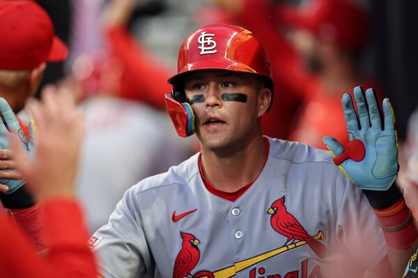 St. Louis Cardinals' Lars Nootbaar celebrates with teammates in the dugout after hitting a two-run home run in the third inning of a baseball game against the Atlanta Braves, Tuesday, April 22, 2025, in Atlanta. (AP Photo/Colin Hubbard)