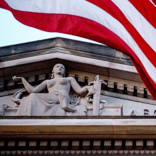 FILE - An American flag flies outside the Department of Justice in Washington, March 22, 2019. (AP Photo/Andrew Harnik, File)