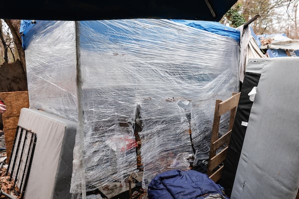 Views of Matthew Welch’s tent at an encampment near Buford Highway shown on Friday, December 29, 2023. Welch says he uses plastic wrap around his tent to shield himself from freezing temperatures. (Natrice Miller/ Natrice.miller@ajc.com)