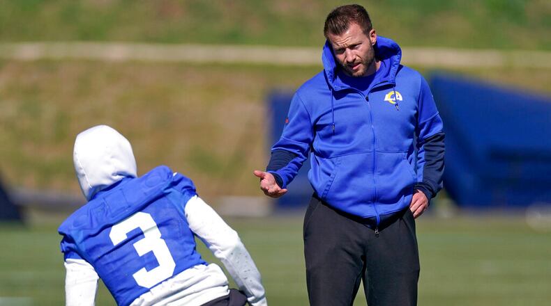 Los Angeles Rams head coach Sean McVay, right, talks to wide receiver Odell Beckham Jr. during practice for an NFL Super Bowl football game Wednesday, Feb. 9, 2022, in Thousand Oaks, Calif. The Rams are scheduled to play the Cincinnati Bengals in the Super Bowl on Sunday. (AP Photo/Mark J. Terrill)