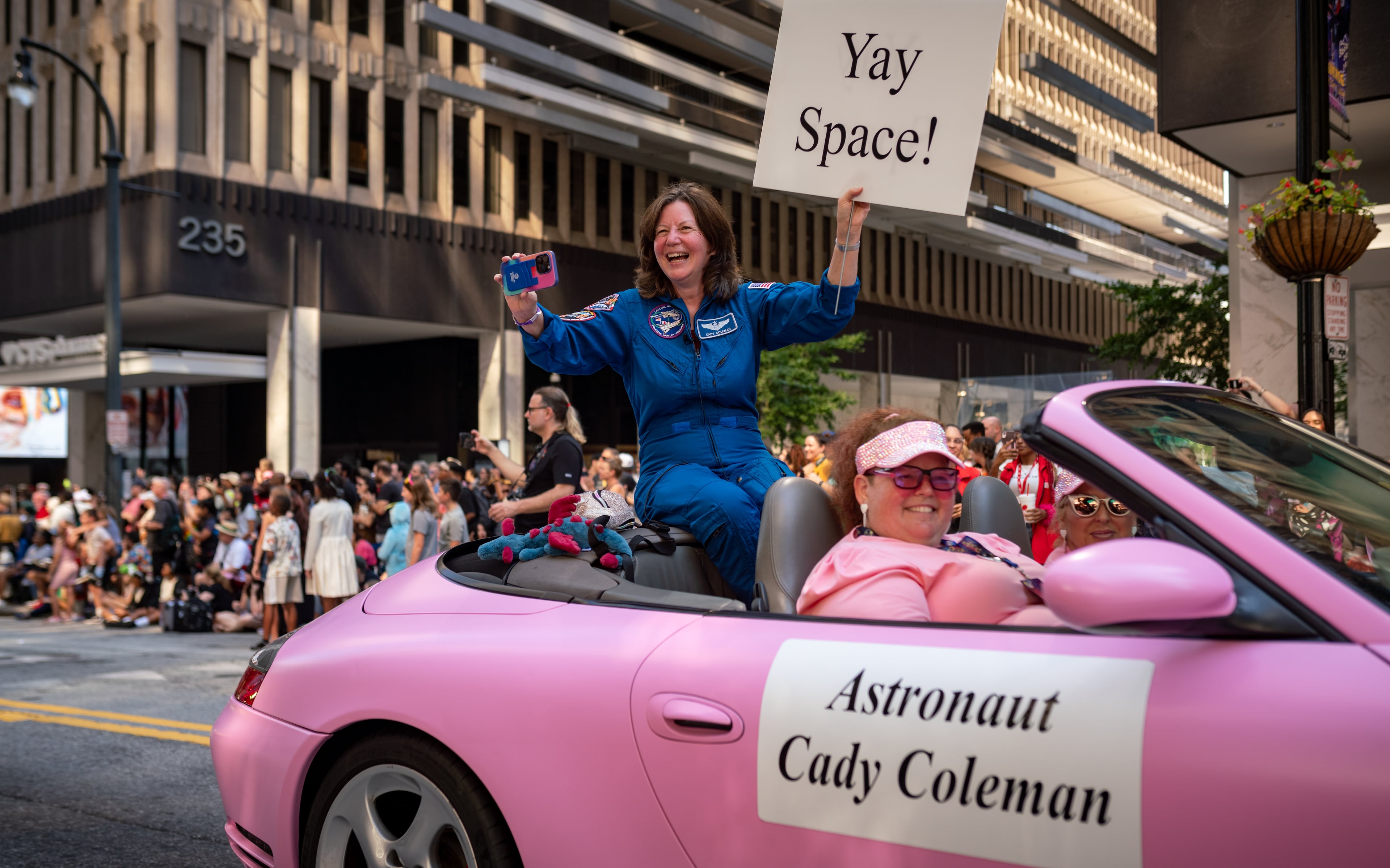 Cady Coleman, a real-life astronaut who has published a book about her career, was among this year's guests at Dragon Con in Atlanta. Thousands lined up along Peachtree Street on Saturday morning, August 31, 2024, for the parade that included Coleman along with costumed characters. (Ben Hendren for The Atlanta Journal-Constitution)