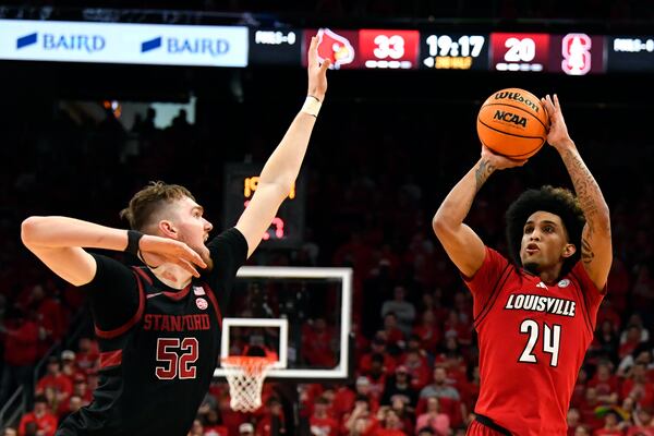 Louisville guard Chucky Hepburn (24) shoots over Stanford forward Aidan Cammann (52) during the second half of an NCAA college basketball game in Louisville, Ky., Saturday, March 8, 2025. (AP Photo/Timothy D. Easley)