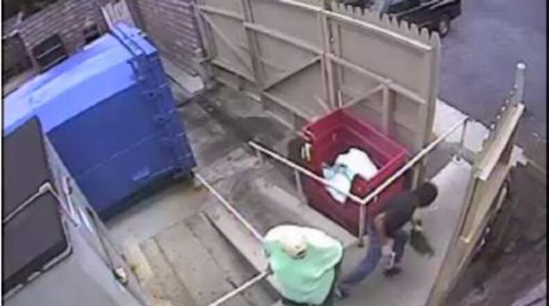 An unidentified man wearing a black mask, a black short sleeved shirt, white gloves, dark jeans and black sneakers stole a bag full of money belonging to McKendrick’s Steakhouse (Courtesy Dunwoody Police Department)