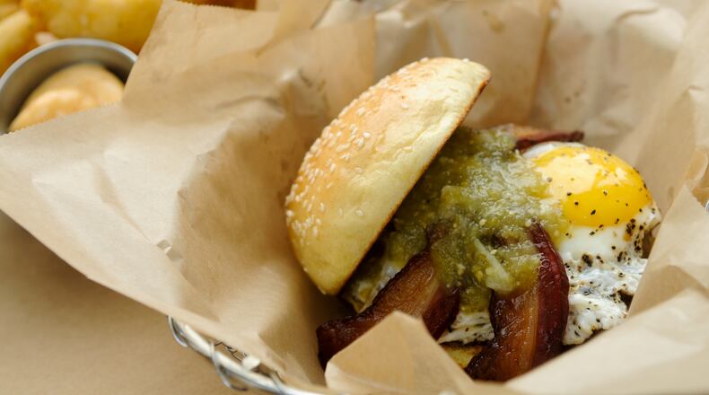 100515-DECATUR-GA- Weekly dine review of Farm Burger in Decatur on Saturday May 15, 2010. FOOD: Number 6 burger- house-cured bacon, sunny side up egg, pepper jack cheese and salsa verde. seasonal pickles and beer-battered onion rings with smoked paprika mayo.(BECKY STEIN/special)