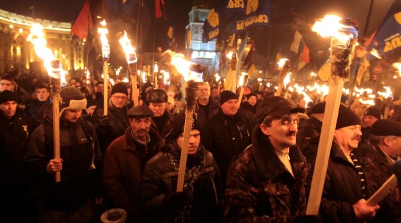 Ukrainian nationalists march through Kiev in a torch-lit parade similar to that in Charlottesville, Va. (AP)