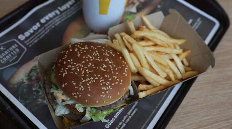 Police said a man stole boxes of food from a McDonald's, carting the items out the back door on a dolly.