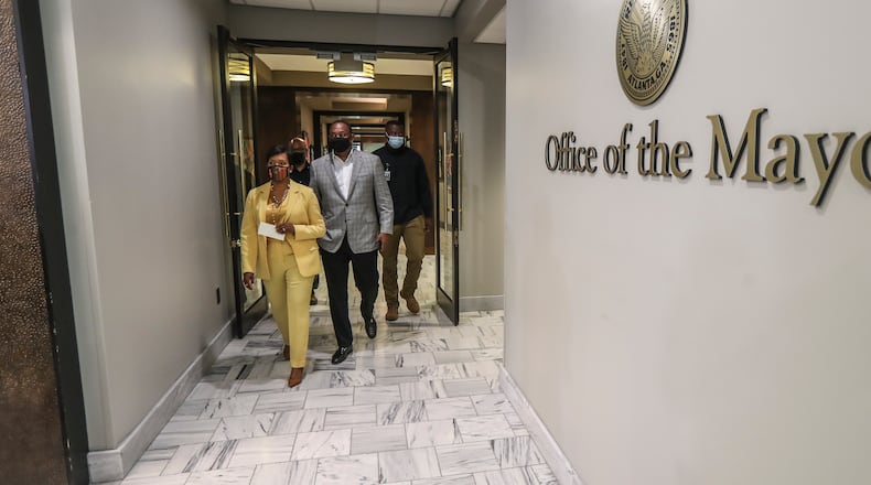 May 7, 2021 Atlanta: Atlanta Mayor Keisha Lance-Bottoms held a press conference Friday, May 7, 2021 at Atlanta City Hall speaking about her decision not to run for a second term. Here she is shown with husband Derek. In her first public appearance since announcing her decision to supporters Thursday night, Bottoms said her decision was guided by faith. “In the same way that it was very clear to me almost five years ago that I should run for mayor of Atlanta, it is abundantly clear to me today that it is time to pass the baton on to someone else,” Bottoms said at an emotional news conference at City Hall. (John Spink / John.Spink@ajc.com)
