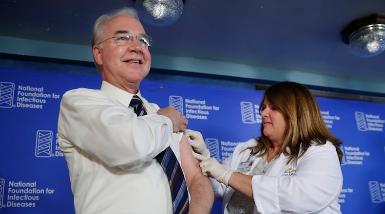 Health and Human Services Secretary Tom Price, left, receives a flu vaccination from Sharon Walsh-Bonadies, a registered nurse, during a Thursday press conference recommending everyone age six months an older be vaccinated against influenza each year. AP/Pablo Martinez Monsivais