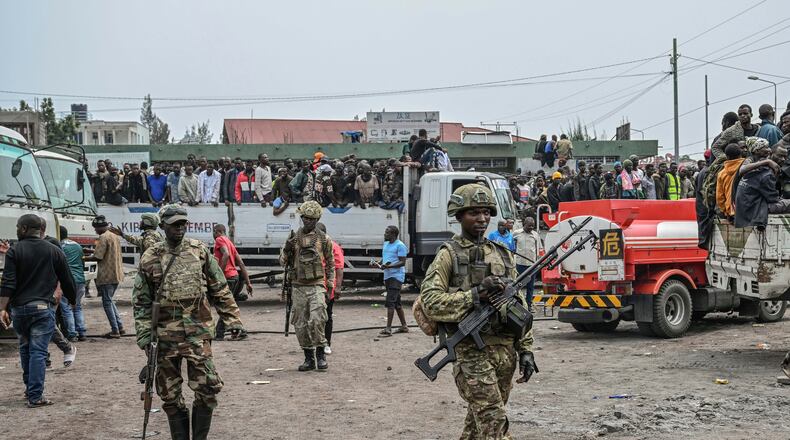 FILE - M23 rebels escort government soldiers and police who surrendered to an undisclosed location in Goma, Democratic republic of the Congo, Thursday, Jan. 30, 2025. (AP Photo/Moses Sawasawa, File)