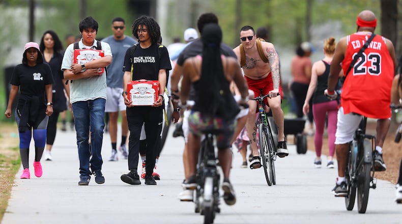 An afternoon in March 2020 with walkers and riders competing for limited path space on the Atlanta Beltline. (Curtis Compton/AJC)