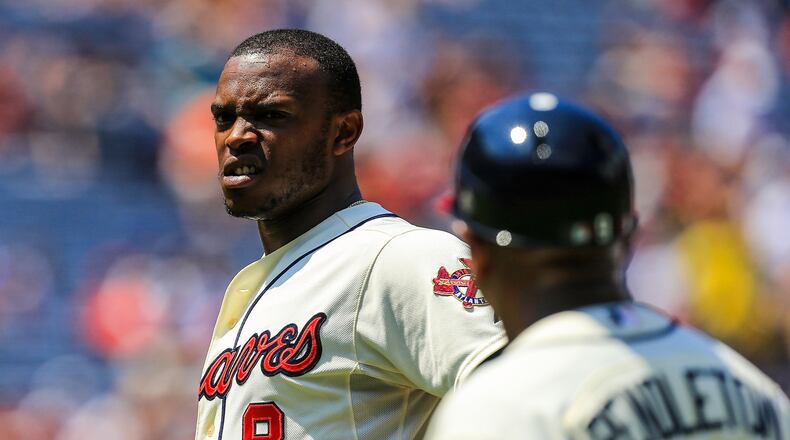 Atlanta Braves left fielder Justin Upton (8) comes out of the game with an injury in the fifth inning against the Miami Marlins at Turner Field on Aug. 11, 2013.