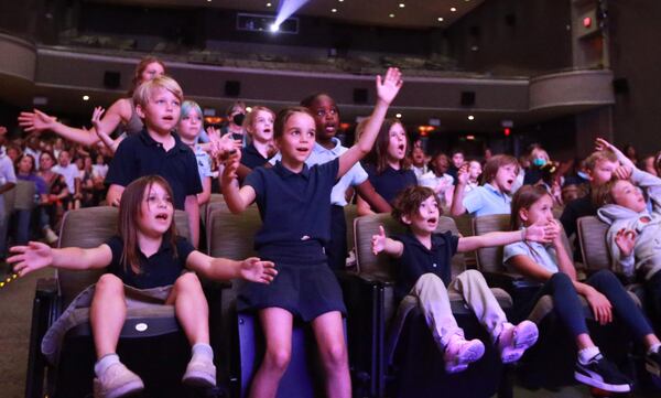 Tybee Island Maritime Academy students sing along to "Deep and Wide" during the Savannah Music Festival Musical Explorers concert at Trustees Theater.