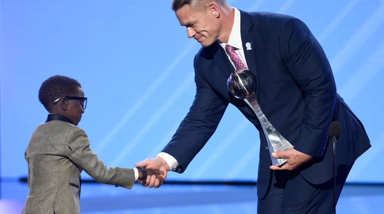 John Cena, right, presents New Orleans Saints superfan Jarrius "J.J." Robertson the Jimmy V perseverance award at the ESPYS at the Microsoft Theater on Wednesday, July 12, 2017, in Los Angeles. (Photo by Chris Pizzello/Invision/AP)