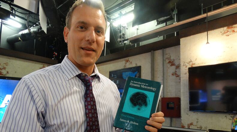 Mike Bettes included one of his college textbook as a prop for the set of his new evening "Weather Underground" show debuting at 6 p.m. Monday, August 24, 2015.