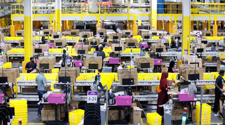 Dozens of Amazon employees work at the Single Pack Station, where packages are prepared for delivery on Monday, December 2, 2024, at the Amazon distribution center in Stone Mountain, where hundreds of thousands of orders were fulfilled on Cyber Monday.
(Miguel Martinez / AJC)