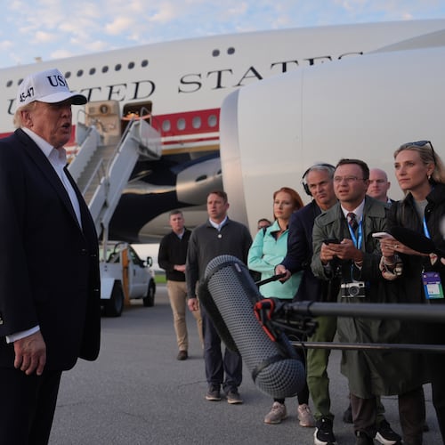 U.S. President Donald Trump speaks with journalists prior to boarding Air Force One at Shannon Airport in Shannon, Ireland, Sunday, Sept. 13, 2026. (AP Photo/Julia Demaree Nikhinson)