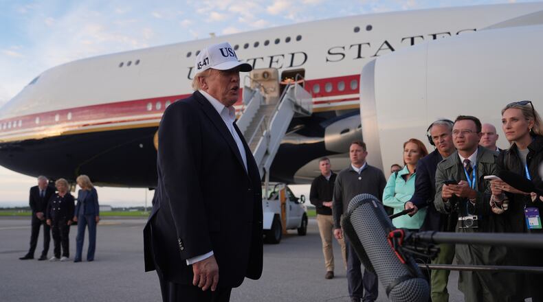 U.S. President Donald Trump speaks with journalists prior to boarding Air Force One at Shannon Airport in Shannon, Ireland, Sunday, Sept. 13, 2026. (AP Photo/Julia Demaree Nikhinson)