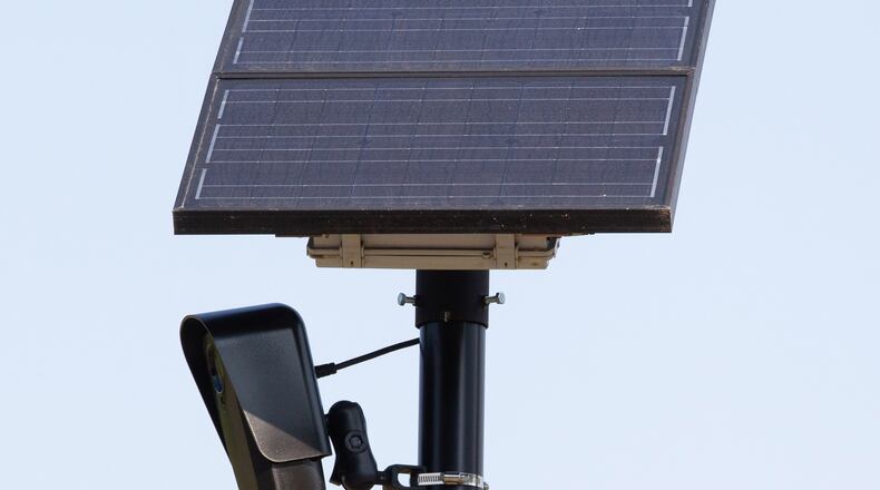 A license plate-reading camera stands by one of the entrances to the Walmart on Collins Hill Road in Lawrenceville. STEVE SCHAEFER FOR THE ATLANTA JOURNAL-CONSTITUTION