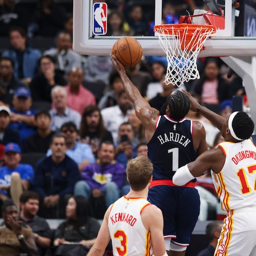 Los Angeles Clippers guard James Harden drives to the basket against Atlanta Hawks forward Onyeka Okongwu as guard Luke Kennard watches during the first half of an NBA basketball game Monday, Nov. 10, 2025, in Inglewood, Calif. (Jessie Alcheh/AP)