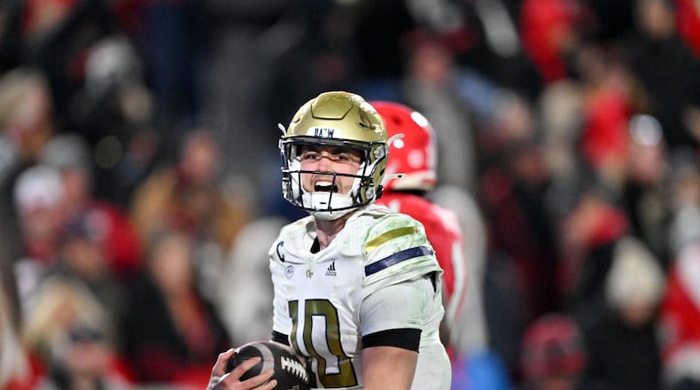 Georgia Tech quarterback Haynes King (10) celebrates after scoring a touchdown during the fourth quarter in an NCAA football game at Sanford Stadium, Friday, November 29, 2024, in Athens. Georgia won 44-42 in eight overtimes. (Hyosub Shin / AJC)