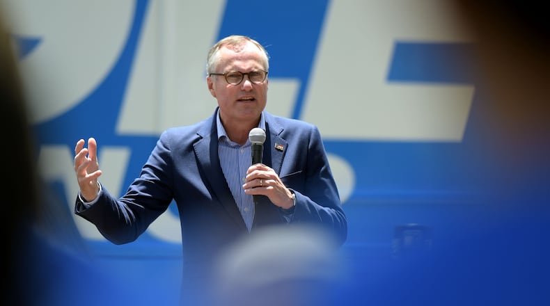 7/19/18 - McDonough - Lt. Gov. Casey Cagle speaks to people in McDonough Square at one of his bus tour stops for his campaign for Georgia governor on Thursday, July 19, 2018. Jenna Eason / Jenna.Eason@coxinc.com