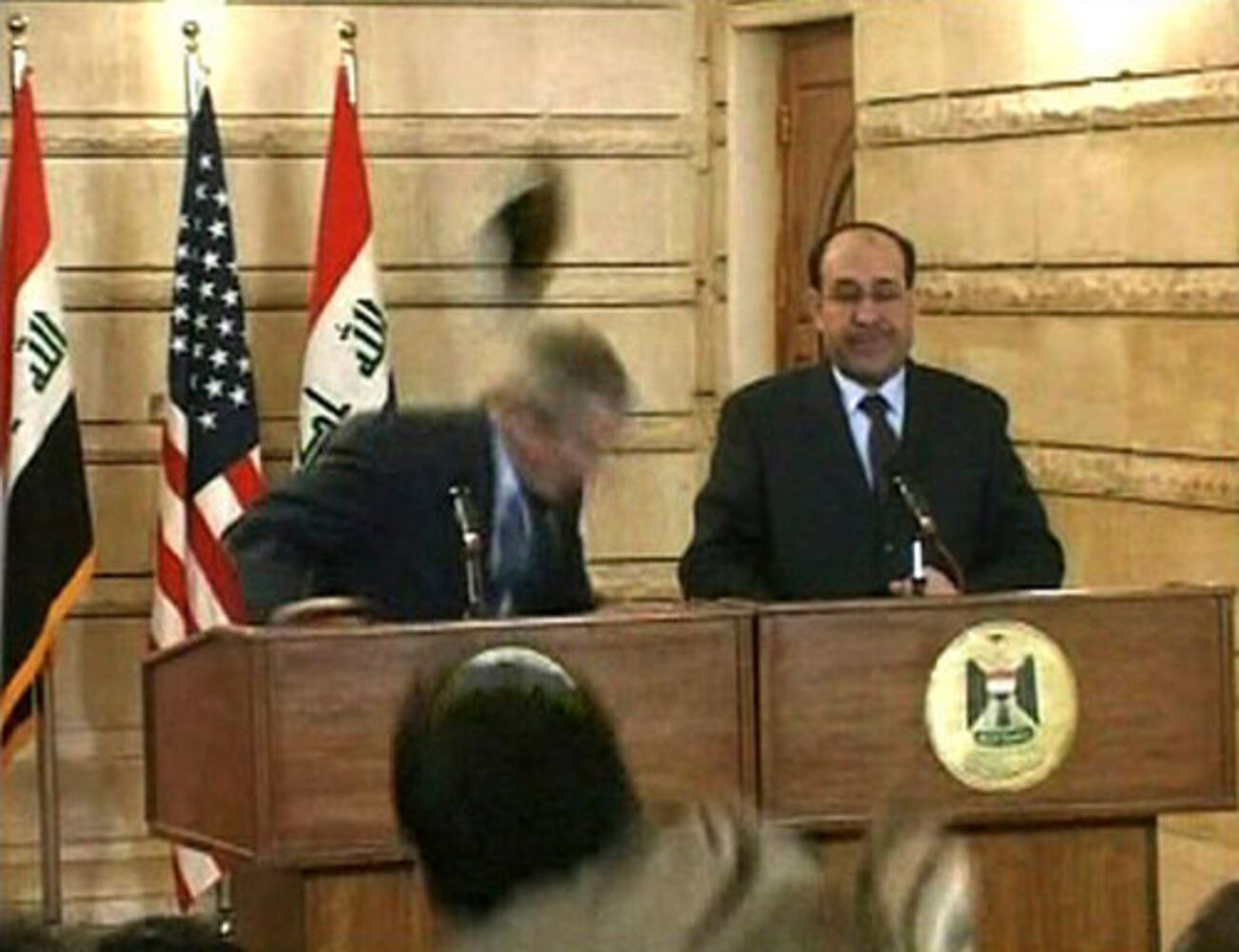 Man throws shoes at Bush