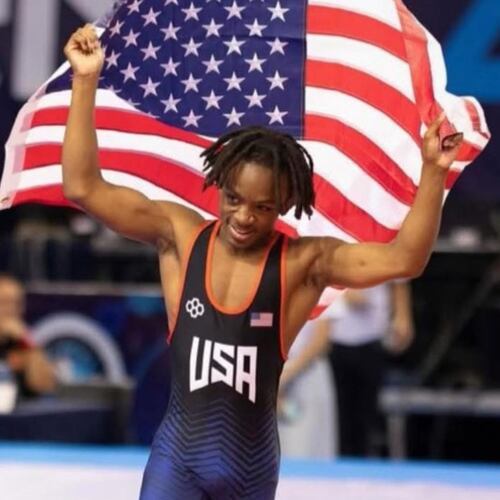 Antonio Mills celebrates his national championship. Mills, a senior at Mill Creek, is going for his fourth GHSA title. (Byron Hendrix)