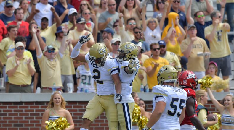 Georgia Tech wide receiver Ricky Jeune (2) and Tech quarterback TaQuon Marshall (16) celebrate after Tech wide receiver Ricky Jeune (2) caught a touchdown pass in the first half of the Tech home opener at Bobby Dodd Stadium on Saturday, September 9, 2017.  HYOSUB SHIN / HSHIN@AJC.COM
