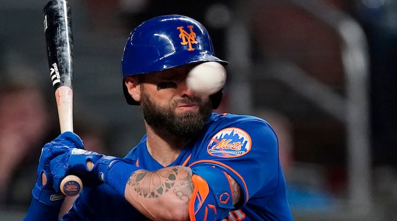 Mets' Kevin Pillar is hit in the face with a pitch from Braves reliever Jacob Webb in the seventh inning Monday, May 17, 2021, at Truist Park in Atlanta.