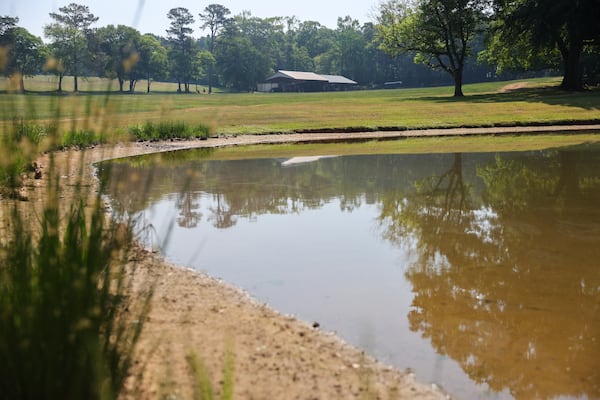 A farm pond that farmer Lee Nunn depends on to irrigate his cotton field has lost water due to the ongoing drought. (Arvin Temkar/AJC)