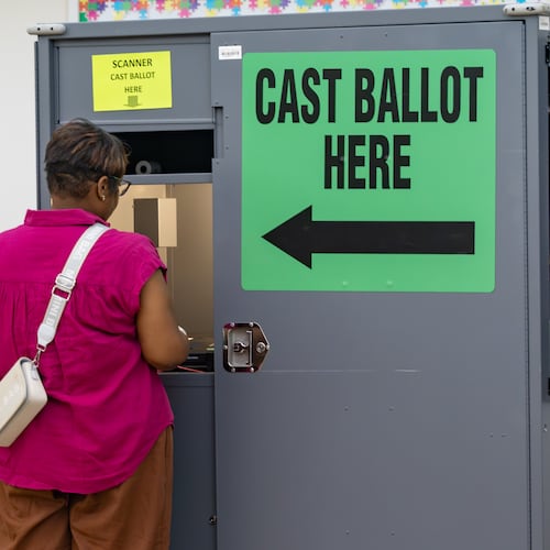 A woman casts her ballot at the Trinity United Methodist Church polling location on Tuesday, May 19, 2026, in Austell. (Ben Hendren for the AJC)