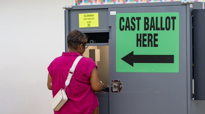 A woman casts her ballot at the Trinity United Methodist Church polling location on Tuesday, May 19, 2026, in Austell. (Ben Hendren for the AJC)