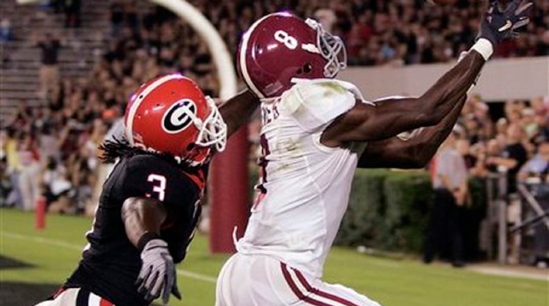 Alabama’s Julio Jones (8) makes a catch for a touchdown as Georgia’s Bryan Evans defends during the second quarter of an NCAA college football game in Athens, Ga., Saturday, Sept. 27, 2008. (AP Photo/John Bazemore)