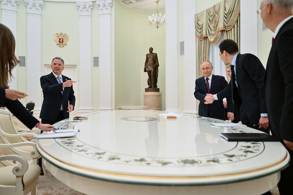 Russian President Vladimir Putin, third right, and U.S. President Donald Trump's special envoy Steve Witkoff, left, arrive to attend their talks at the Kremlin in Moscow, Russia, Friday, April 25, 2025. (Kristina Kormilitsyna, Sputnik, Kremlin Pool Photo via AP)