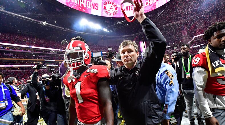 Georgia head coach Kirby Smart and running back Sony Michel leave the field after losing to Alabama on Monday, January 8, 2018. HYOSUB SHIN / HSHIN@AJC.COM