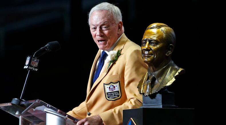 Dallas Cowboys owner Jerry Jones speaks next to a bust of him during inductions at the Pro Football Hall of Fame on Saturday, Aug. 5, 2017, in Canton, Ohio.