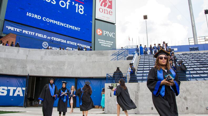 Georgia State University students at the 2018 commencement. REANN HUBER / REANN.HUBER@AJC.COM