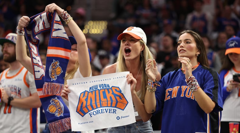New York Knicks fans cheer during the second half of Game 4 in the Eastern Conference finals NBA basketball playoffs series against the Cleveland Cavaliers in Cleveland, Monday, May 25, 2026. (AP Photo/Tim Phillis)