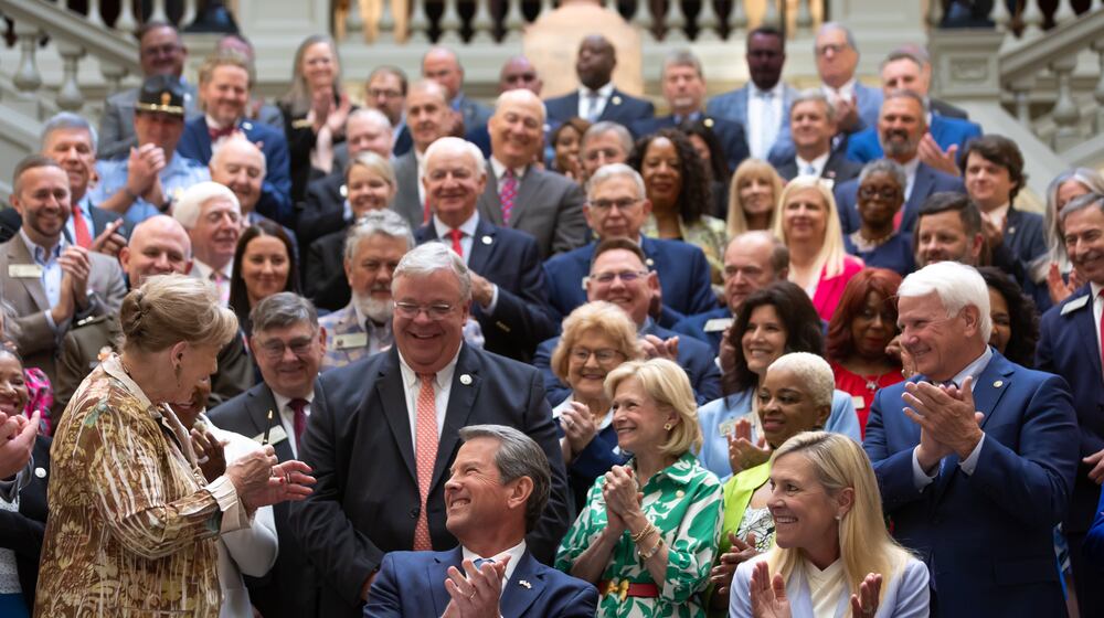 Gov. Brian Kemp (left) next to wife, Marty Kemp (right) on May 7, 2024 signed a $36.1 billion budget for fiscal 2025. Will Kemp run for Senate? (John Spink/AJC)