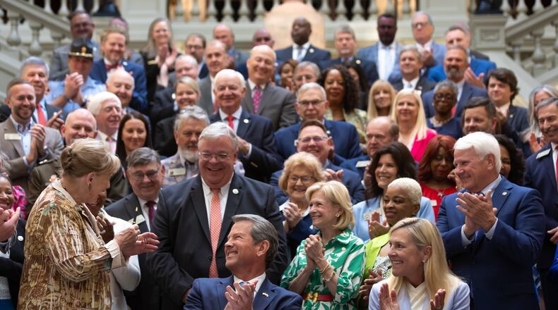 Gov. Brian Kemp (left) next to wife, Marty Kemp (right) on May 7, 2024 signed a $36.1 billion budget for fiscal 2025. Will Kemp run for Senate? (John Spink/AJC)