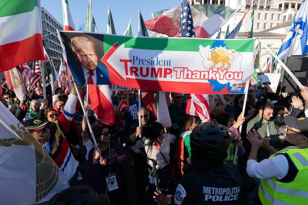 People gathered near the White House on Saturday to show support for the U.S. and Israeli strikes on Iran. (Jose Luis Magana/AP)