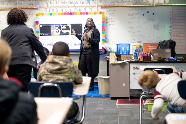 Raven Williams instructs students at Elam Alexander Academy, a GNETS school in Macon during a tour by AJC reporters. Elam caters to students in special education. Staff includes therapeutic and mental health counselors. The school has sensory rooms for student comfort. An AJC investigation has found GNETS programs can vary widely across the state. (Daniel Varnado for the AJC)