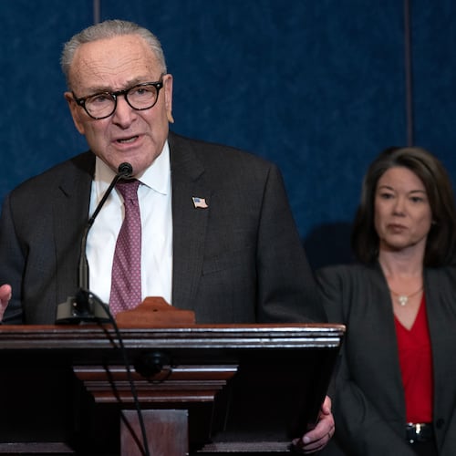Senate Minority Leader Chuck Schumer, D-N.Y., flanked by Rep. Angie Craig, D-Minn., right, speaks during a news conference on legislation to reverse SNAP cuts on Capitol Hill, Thursday, Nov. 20, 2025, in Washington. (AP Photo/Jose Luis Magana)
