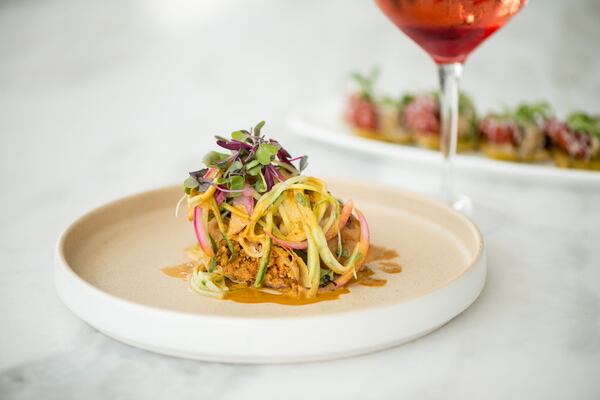 Cochinita Spring Rolls with pulled pork, cucumber, pickled onion, and achiote jus. Photo credit- Mia Yakel.