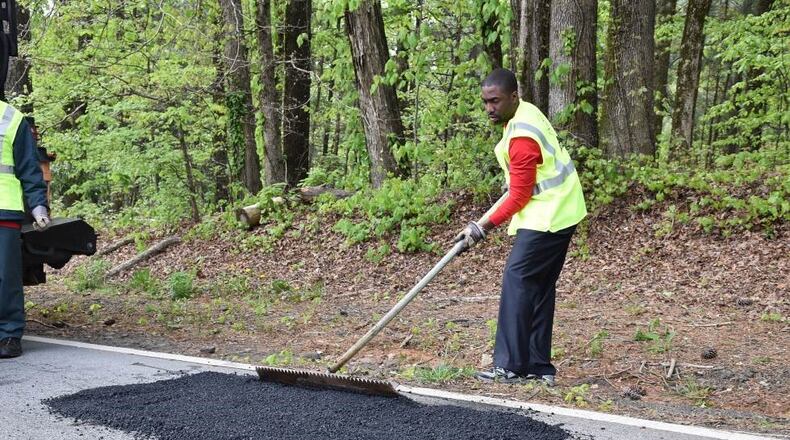 Johns Creek recently approved a contract for roadway maintenance services. AJC File